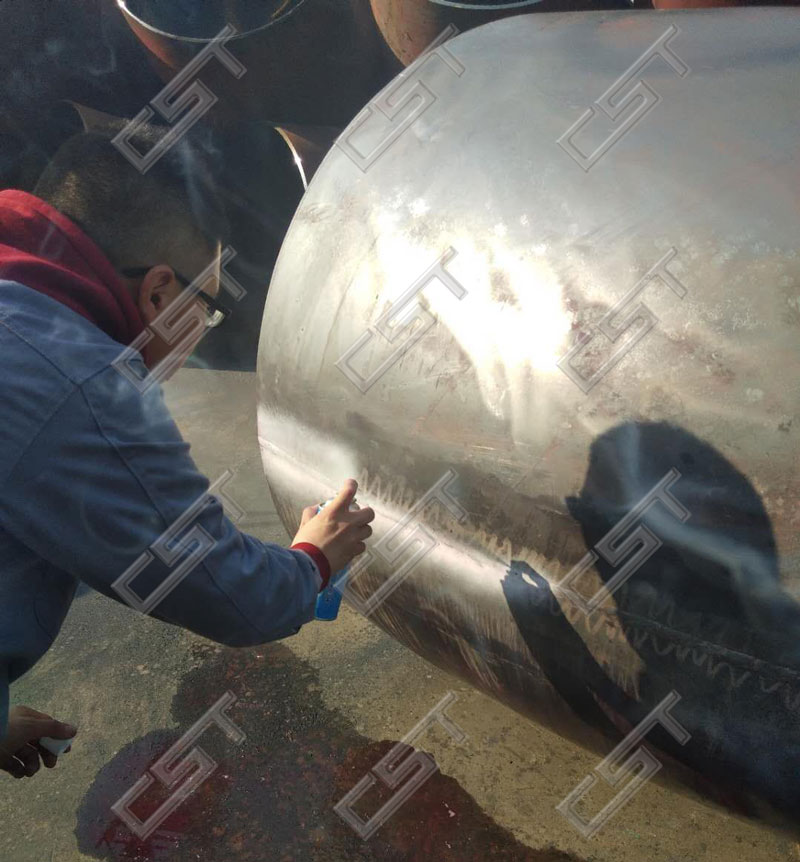 Penetrant testing for large diameter 90 degree elbow weld
